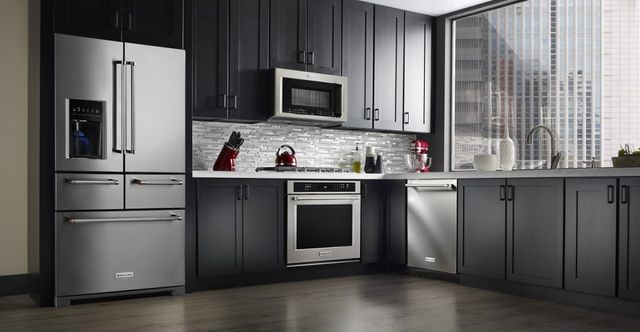 front view of a modern kitchen with a Kitchenaid stainless steel french door refrigerator