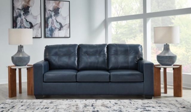 front view of a blue leather sofa in a modern living room