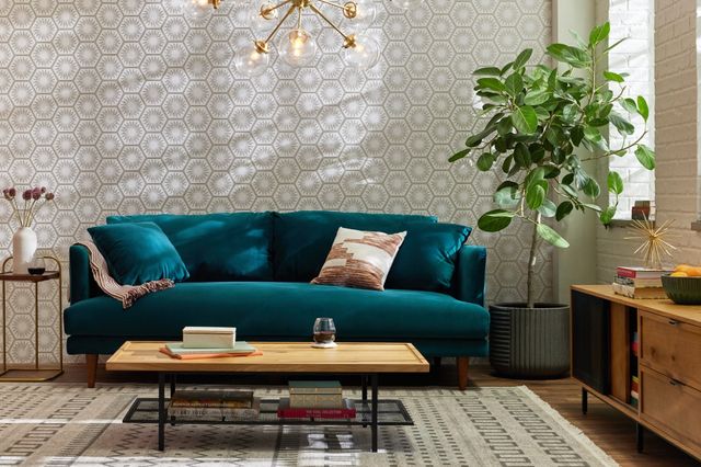 Front view of a mid-century modern living room with a teal Joybird sofa