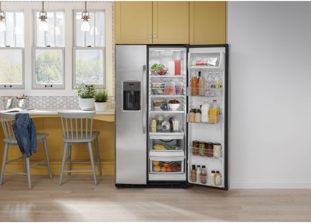 Credit: GE Front view of a casual kitchen with an opened side by side refrigerator