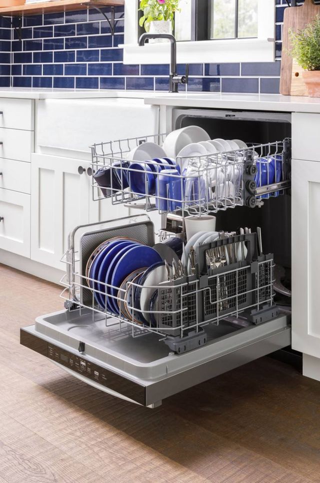 A family enjoying their beautifully remodeled kitchen featuring a new built-in 24-inch dishwasher A family enjoying their beautifully remodeled kitchen featuring a new built-in 24-inch dishwasher