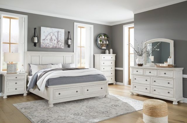 A light wood panel bed frame with white bedding A light wood panel bed frame with white bedding