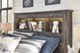 Signature Design by Ashley® Drystan Brown Queen Bookcase Headboard-4