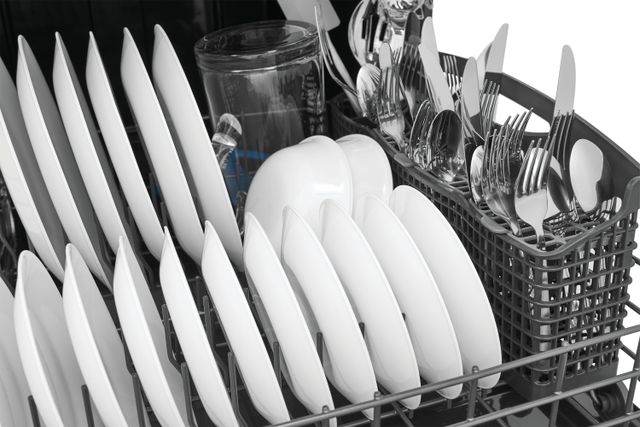 Close view of dishes clean and dry in a dishwasher