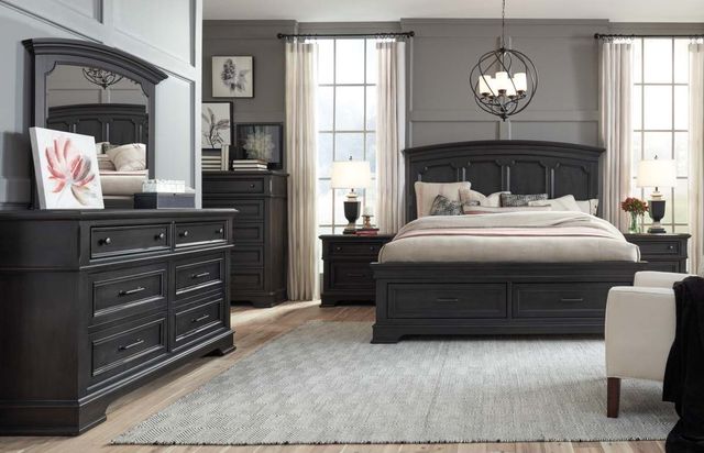 front view of a transitional bedroom with black furntiure