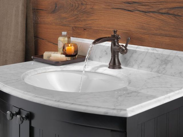 Delta Cassidy® Venetian Bronze Single Handle Channel Bathroom Faucet with Drain-1
