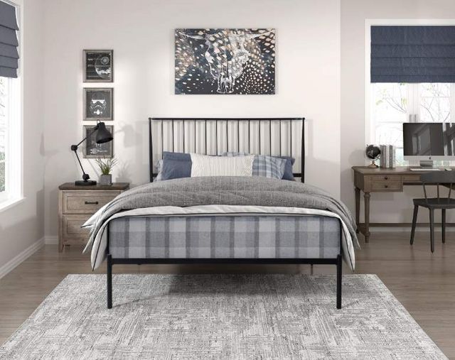 Front view of a modern bedroom with a full size metal bed frame 