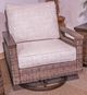 Signature Design by Ashley® Monterey Point Beige/Dark Brown Fabric/Wicker Rattan Outdoor Swivel Lounge Chair-1