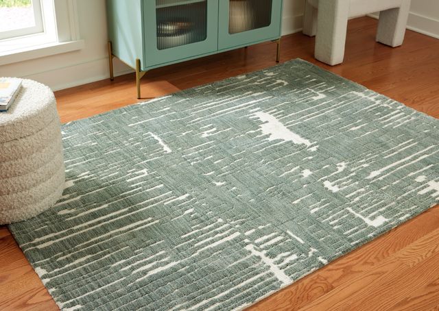 Signature Design by Ashley® Cayworth Teal/White 5'x7' Area Rug-1