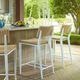 Uttermost® Calbas Honey/White Aluminum/Wicker Outdoor Counter Stool-1