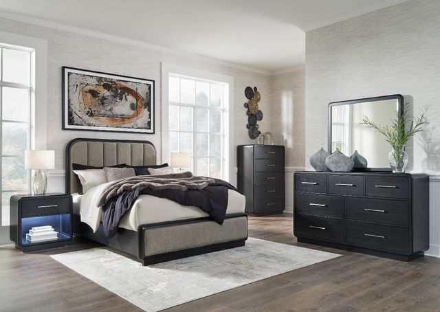 Front view of a modern bedroom with a Signature Design by Ashley queen size bedroom set