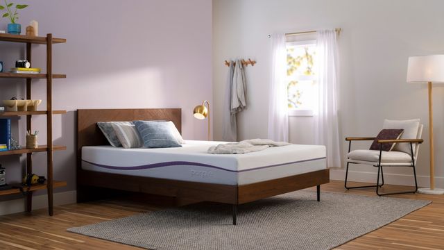Front view of a modern bedroom with a full size bed and mattress