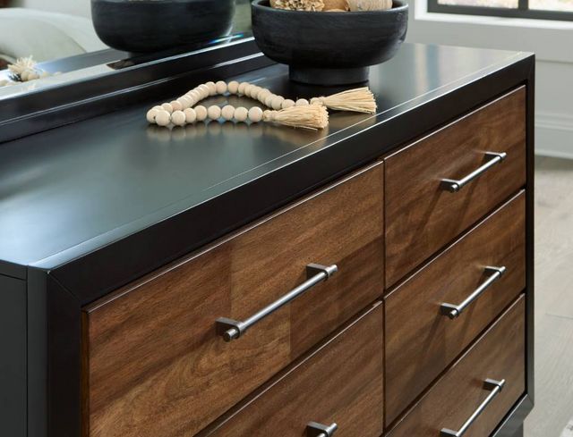 close view of a modern two-tone dresser with mirror