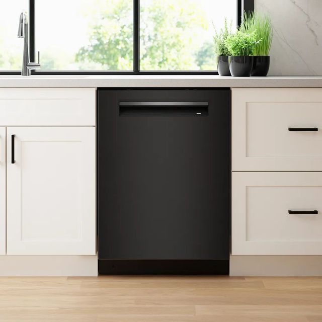 Front view of a modern kitchen with a Bosch black stainless steel dishwasher