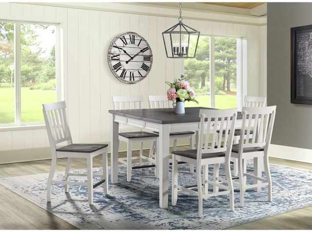 front view of a modern farmhouse dining room with a table and chairs and various accents