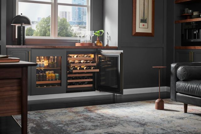 Front view of a modern home office bar with a Sub-Zero wine cooler and beverage center.