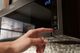 Whirlpool® 1.1 Cu. Ft. Black Stainless Over The Range Microwave-1