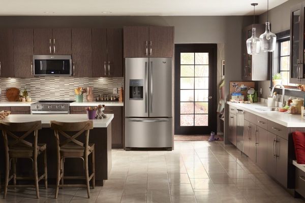 Kitchen with a stainless steel Whirlpool refrigerator