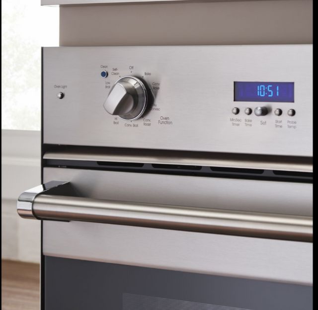Close view of a Viking wall oven with the knob turned on bake mode, showing the various cooking settings and display screen.