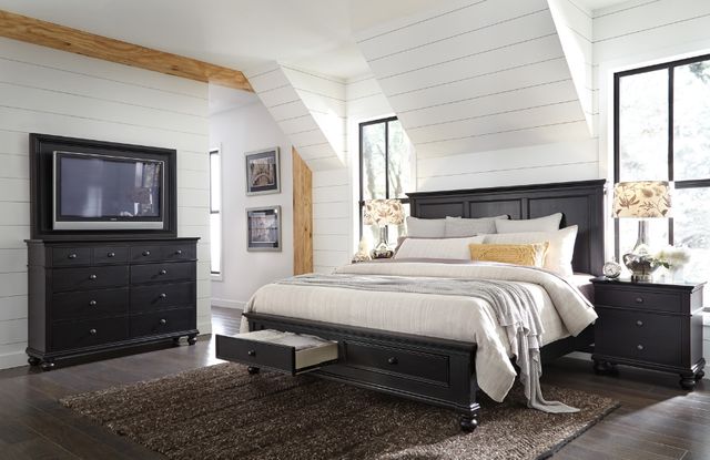 A modern black dresser with plants A modern black dresser with plants
