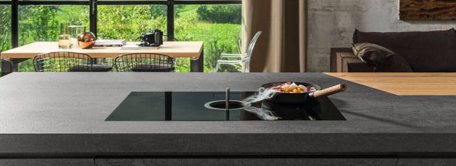 Credit: Elicia Front view of a modern kitchen with a downdraft induction cooktop