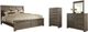 Signature Design by Ashley® Juararo 4-Piece Dark Brown California King Panel Bed Set-0