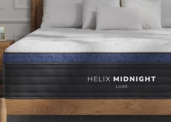 A couple sleeping comfortably on a luxurious Helix Luxe mattress, highlighting its advanced ergonomic support. A couple sleeping comfortably on a luxurious Helix Luxe mattress, highlighting its advanced ergonomic support.
