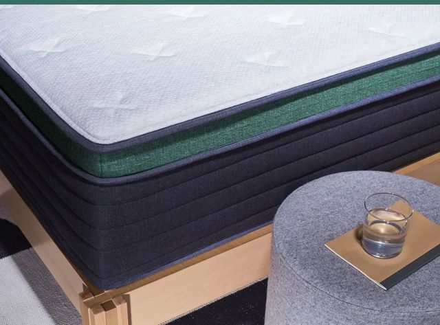 Close view of a Helix mattress in a box corner Close view of a Helix mattress in a box corner