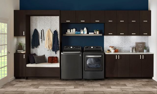 front view of a black lg front load washer and dryer in a modern laundry room