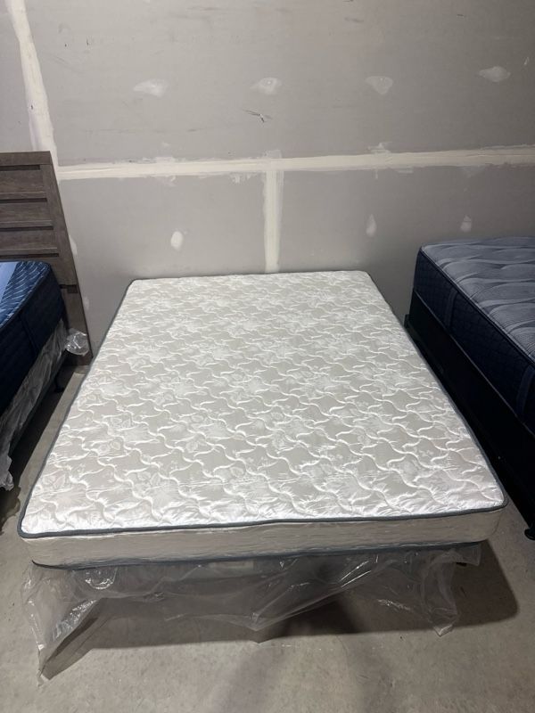 Clearance Sierra Sleep® by Ashley® Innerspring Firm Tight Top Queen Mattress in a Box-0