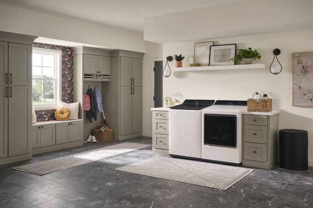 front view of a Maytag white washer and dryer in a casual laundry room.