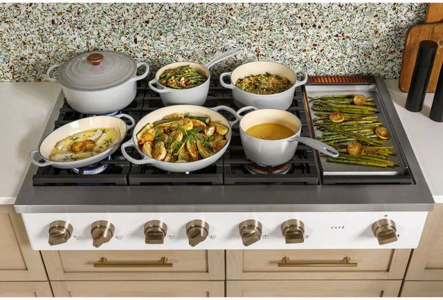 Luxury kitchen featuring a high-performance professional gas rangetop