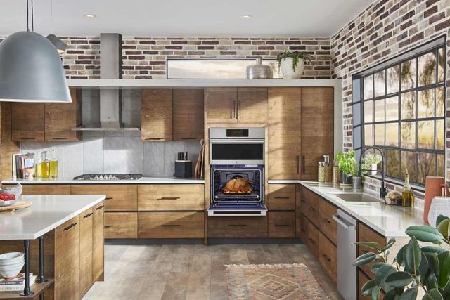 Credit: LG Front view of a modern kitchen with a wall oven microwave combo from LG opened