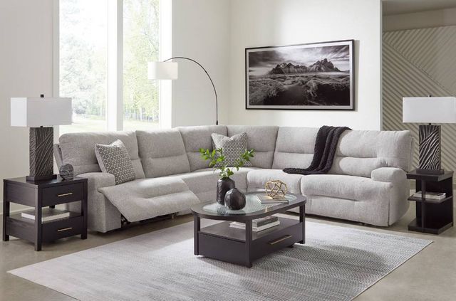 front view of a grey reclining sectional in a contemporary living room
