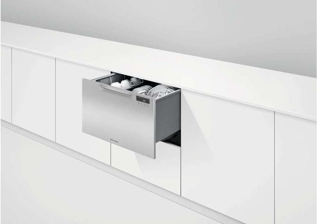 View of modern white cabinetry with a Fisher and Paykel stainless steel dishwasher drawer