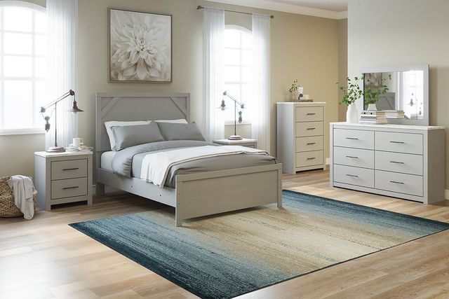 front view of a modern bedroom with beige walls and a light greige modern full bedroom furniture set with a bed, two nightstands, a dresser, and a chest