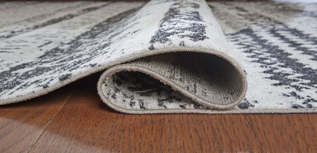 Signature Design by Ashley® Devman Black/Cream/Gray 5'x7' Medium Area Rug-1