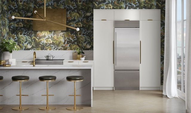 Front view of a modern kitchen with a Sub-Zero bottom freezer refrigerator with an ice maker