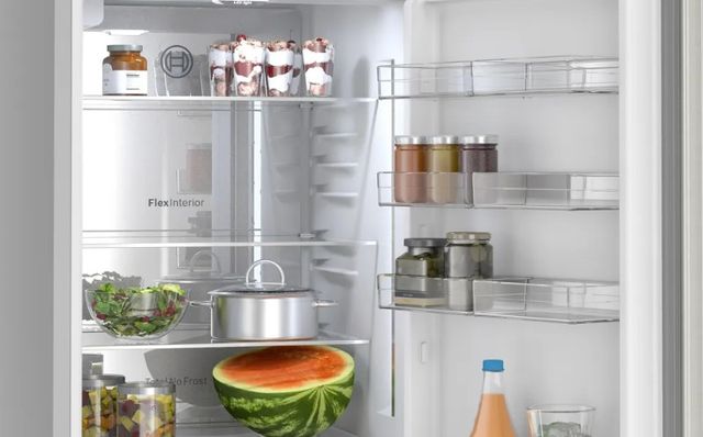 Front view of an opened Bosch 24 inch refrigerator
