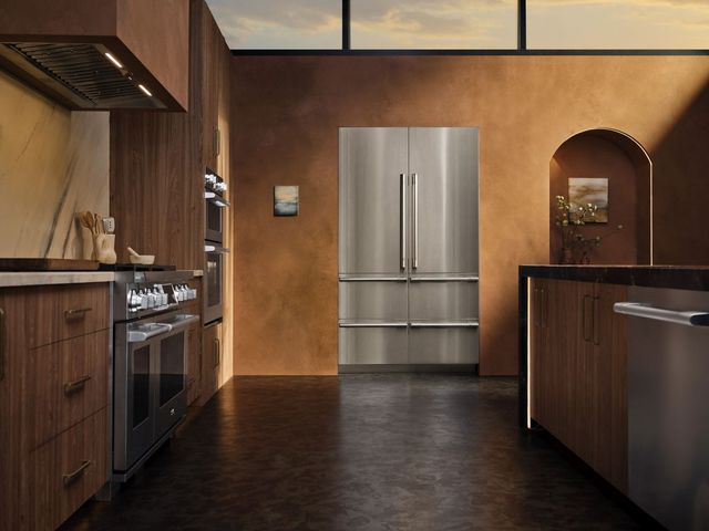 Credit: SKS Front view of a luxury kitchen with an SKS refrigerator, range, and dishwasher