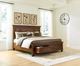 Signature Design by Ashley® Havenstein Warm Brown King Panel Storage Bed-2