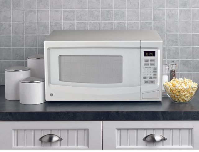 GE® 1.1 Cu. Ft. White Countertop Microwave-1