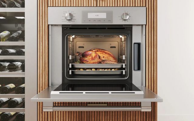 Front view of an opened thermador speed oven