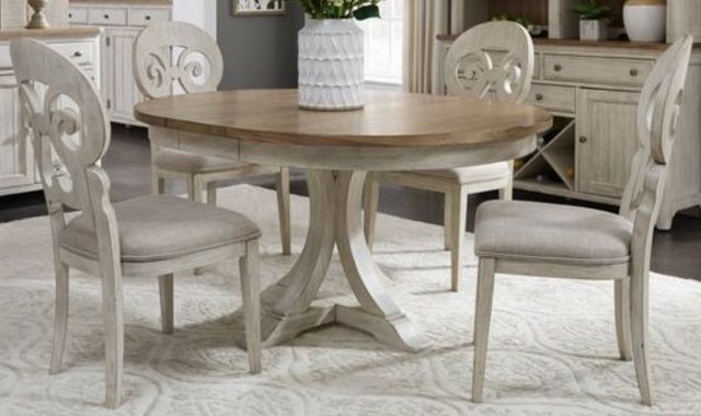 front view of a traditional round farmhouse dining table and chairs