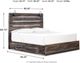 Signature Design by Ashley® Drystan Brown King 4-Drawer Storage Panel Bed-3