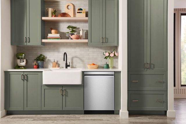 Open drawer dishwasher loaded with dishes Open drawer dishwasher loaded with dishes