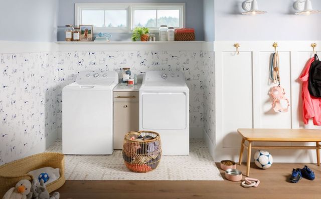 Front view of a casual playroom with a GE washer and dryer
