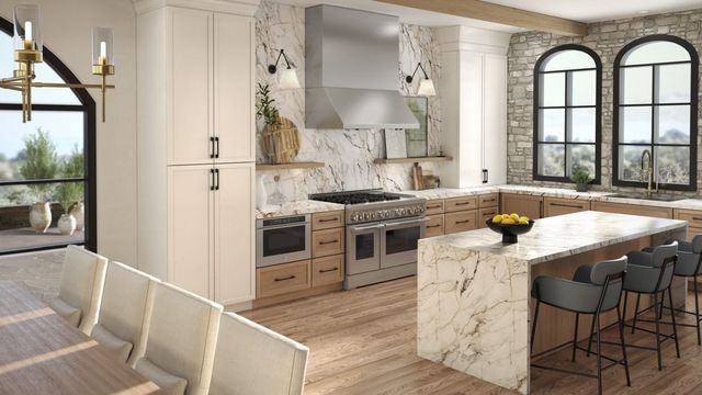front view of a modern white kitchen with a white panel ready french door refrigerator