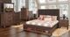 New Classic® Home Furnishings Cagney 4-Piece Chestnut Queen Panel Storage Bedroom Set-1