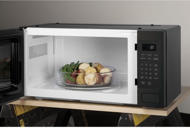 GE Profile™ 1.1 Cu. Ft. Black Stainless Steel Countertop Microwave-1